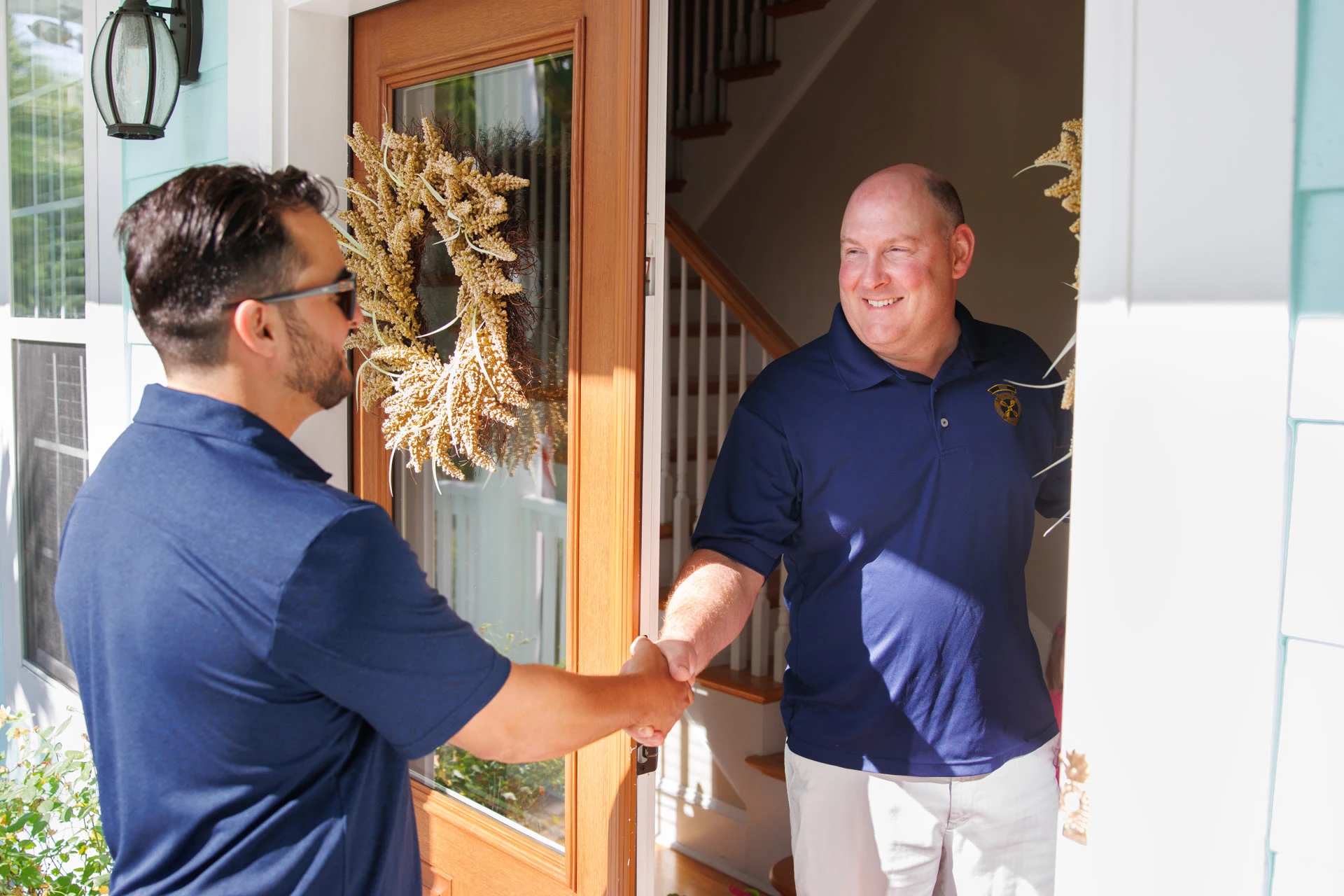 Ship Shape team member greeting a homeowner