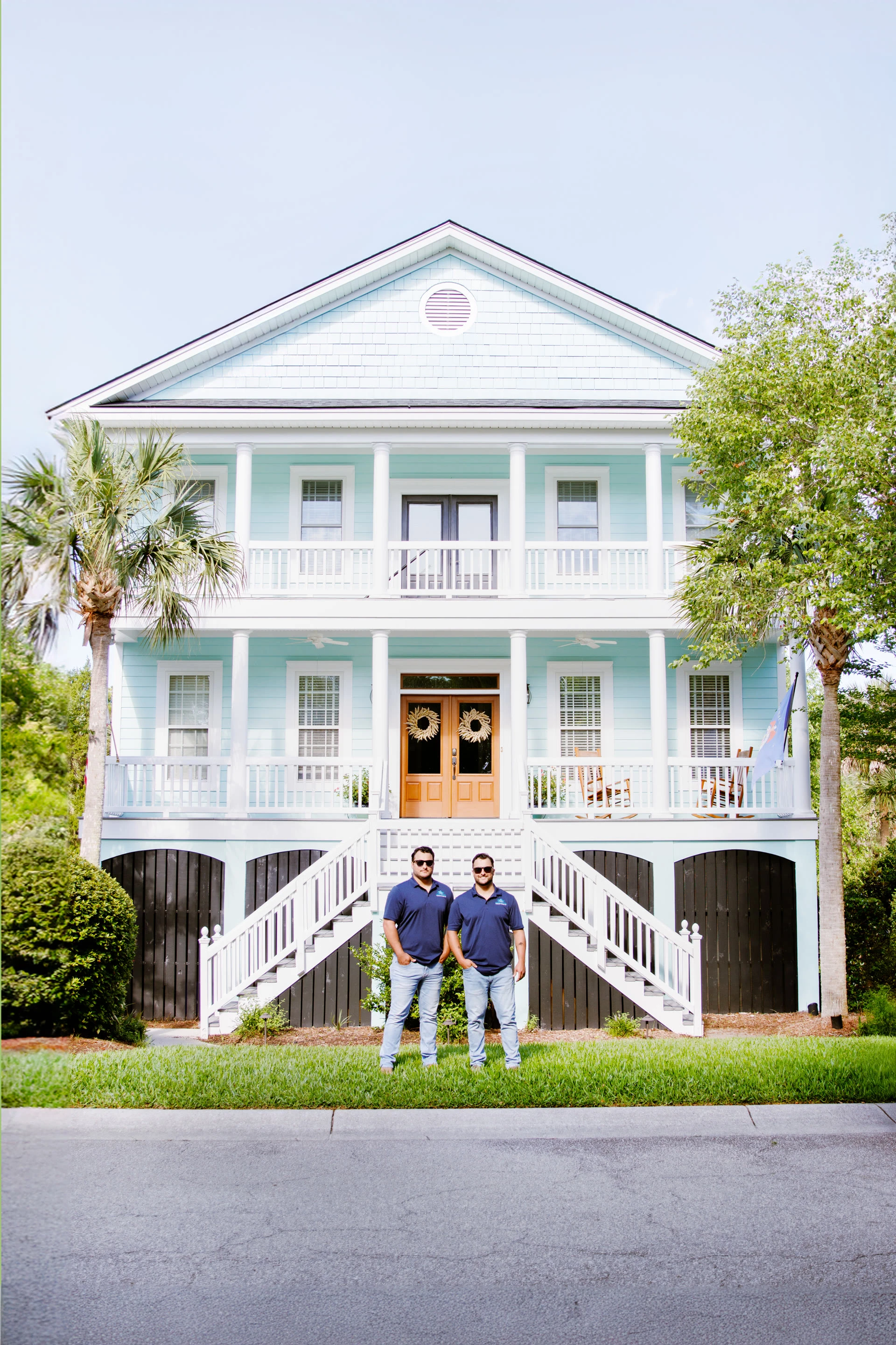 Ship Shape team in front of a Charleston home
